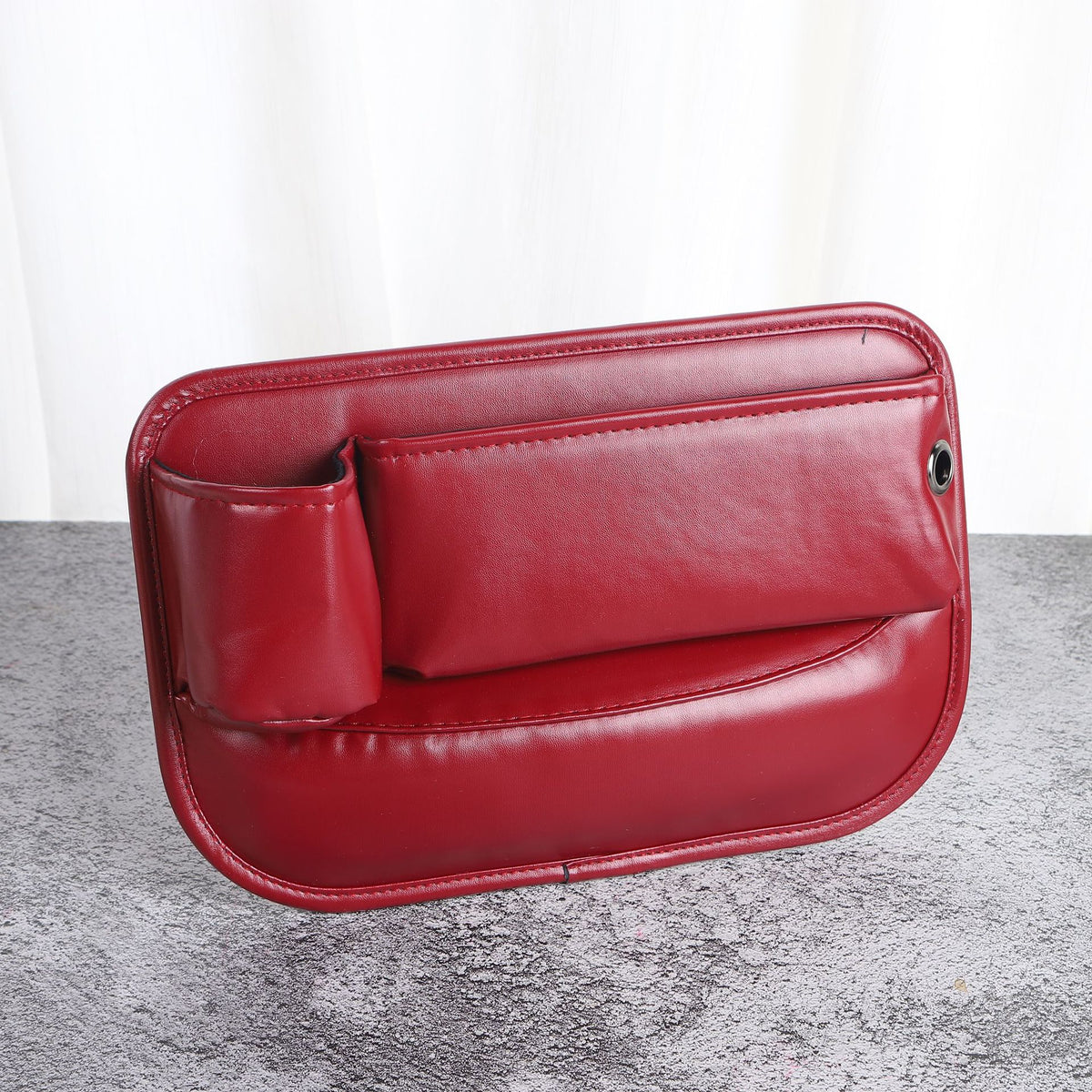 Car seat gap filler storage slots
